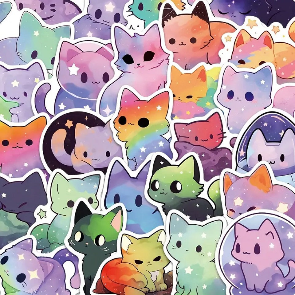 des stickers en forme de chat aux couleurs de la galaxie. Coloris multicolores, décorés d'étoiles et de nuages de toutes les couleurs.