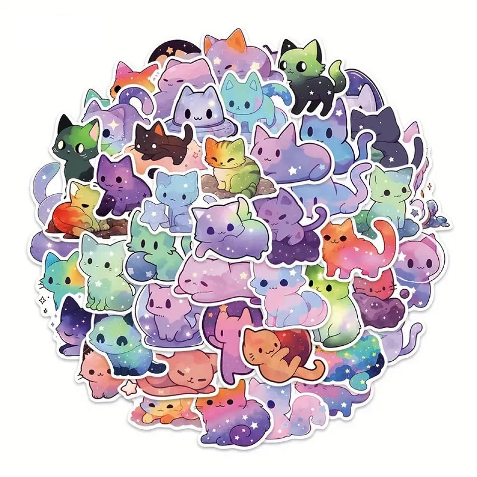 des stickers en forme de chat aux couleurs de la galaxie. Coloris multicolores, décorés d'étoiles et de nuages de toutes les couleurs.