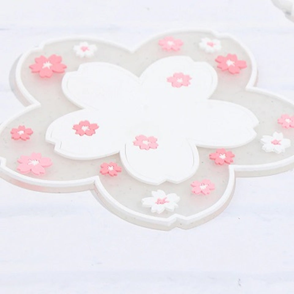 un dessous de verre en forme de fleur de sakura blanche pailleté. Joli élément de décoration