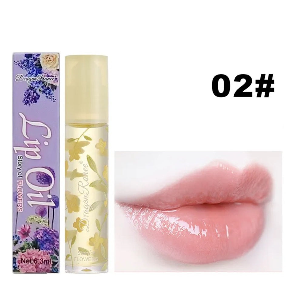 des huiles pour les lèvres aux doux doux parfums de fleurs. Les tubes sont colorés et en verre avec un design de fleurs.