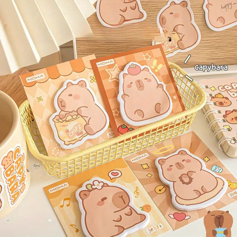 des mémos adhésifs inspirés des capybara. Avec leur expression calme et tendre, ils sont adorables. Dans des positions amusantes et mignonnes, ils sont parfaits pour laisser des messages.