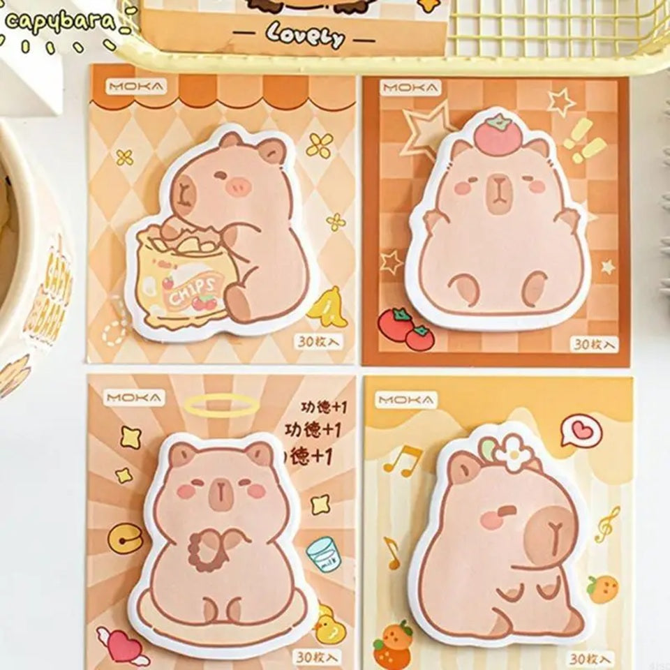 des mémos adhésifs inspirés des capybara. Avec leur expression calme et tendre, ils sont adorables. Dans des positions amusantes et mignonnes, ils sont parfaits pour laisser des messages.