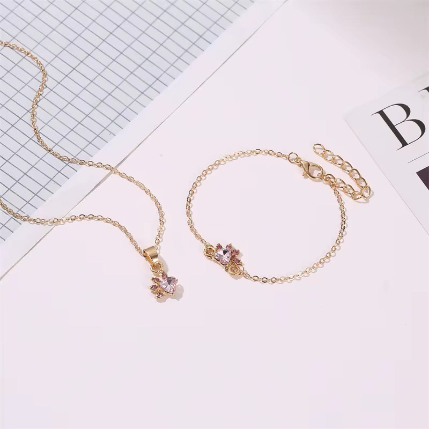 Parure de bijoux pattes de chat roses