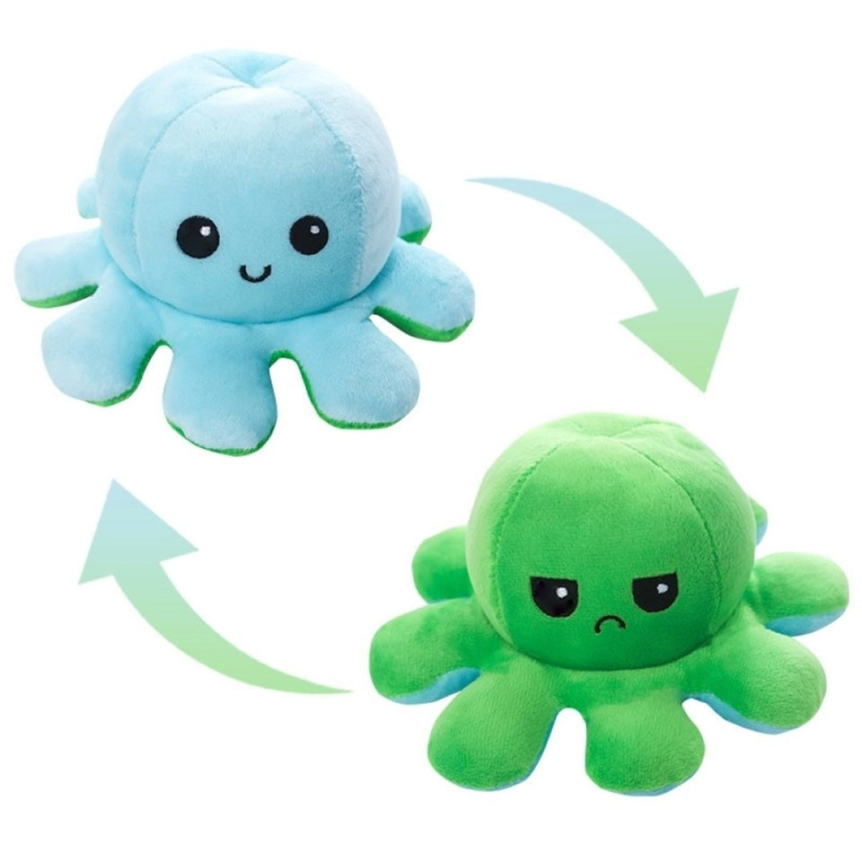 une peluche en forme d'octopus réversible. Elle a deux couleurs : bleu et vert, et on peut la retourner pour montrer notre expression : heureuse ou plutôt fâchée