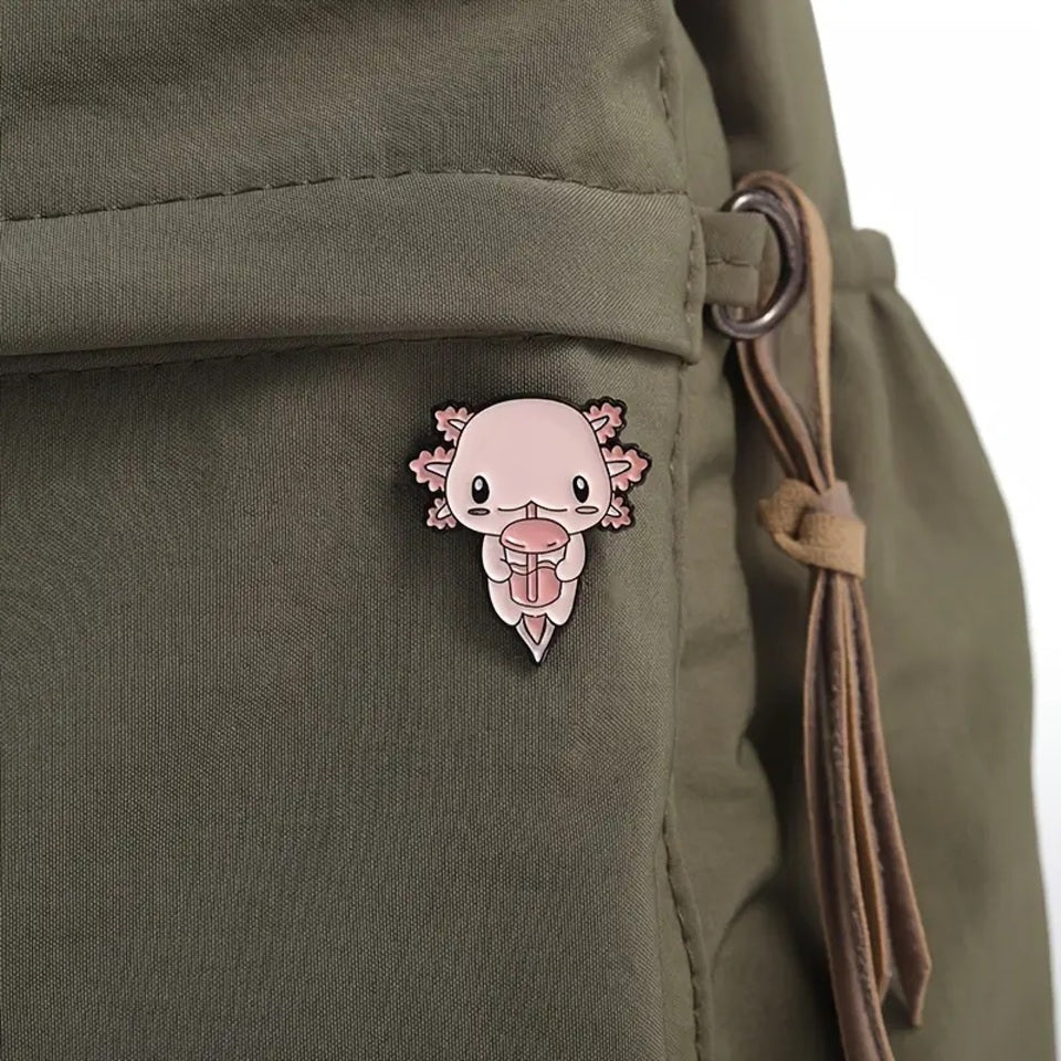 des pin's axolotl tout rose et tout mignon dans différentes poses et expressions kawaii adorables.