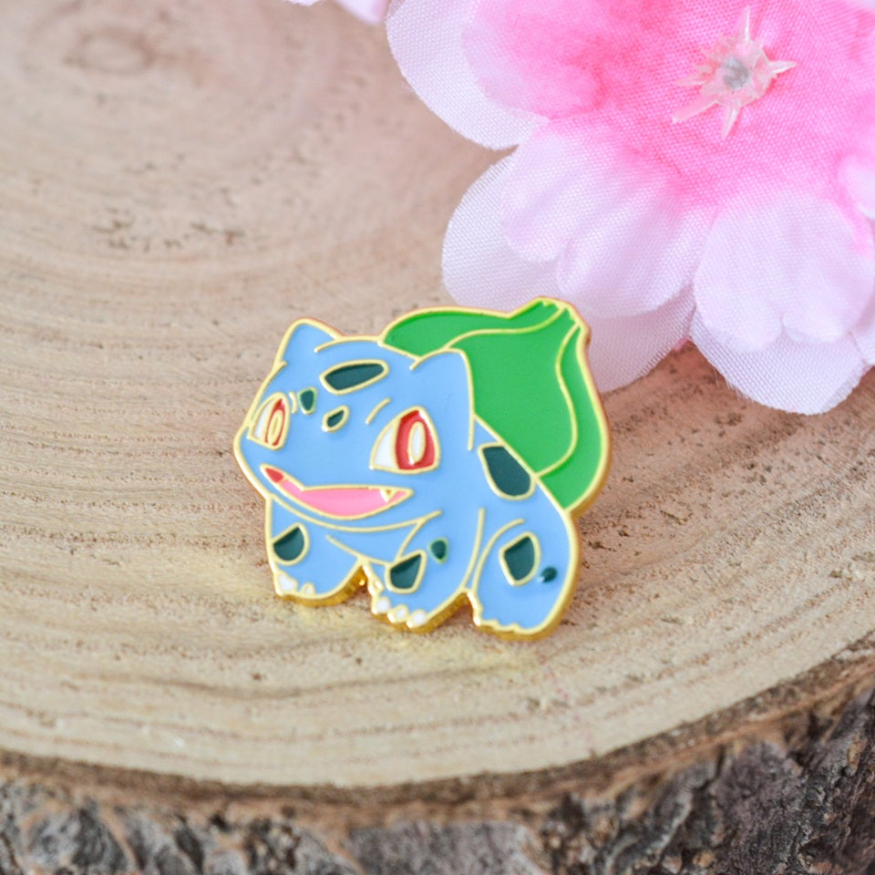 un pin's représentant fidèlement le pokemon Bulbizarre.