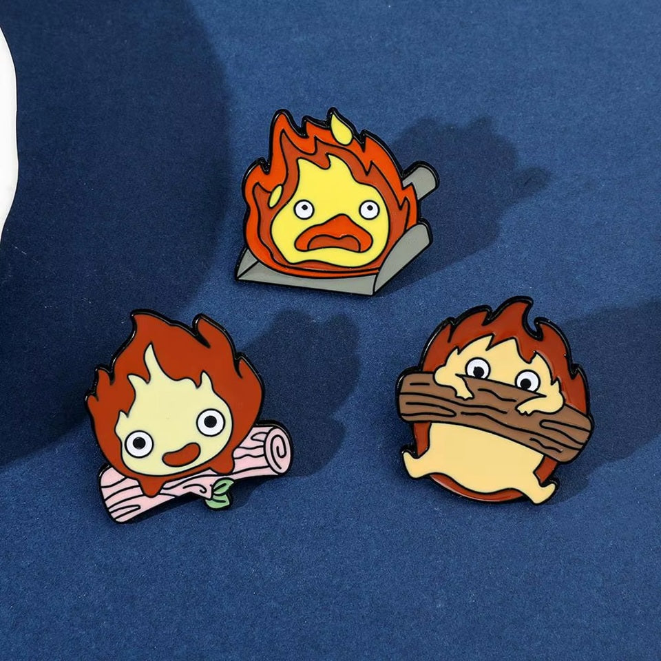 des pin's en forme de calcifer, le petit démon du château ambulant. Il est très drôle et émouvant dans des situations funs inspirés du film