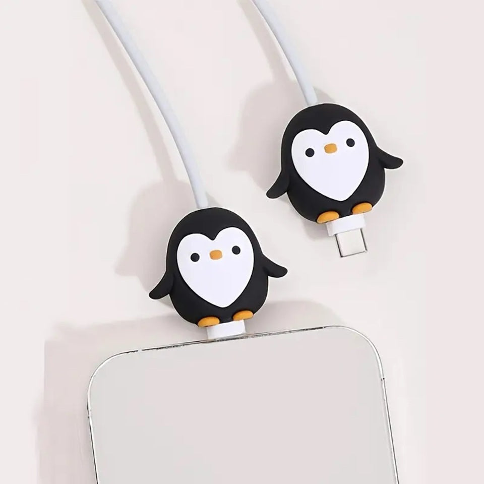 un protège câble en forme de pingouin tout mignon idéal pour protéger et allonger la durée de vie des câbles