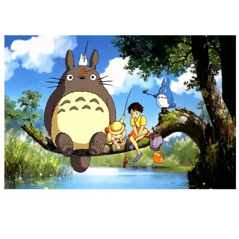 un puzzle composé de 1000pièces reprenant la scène où Mei, Satsuki, Totoro et les chibi pêchent sur une grosse branche d'arbre.
