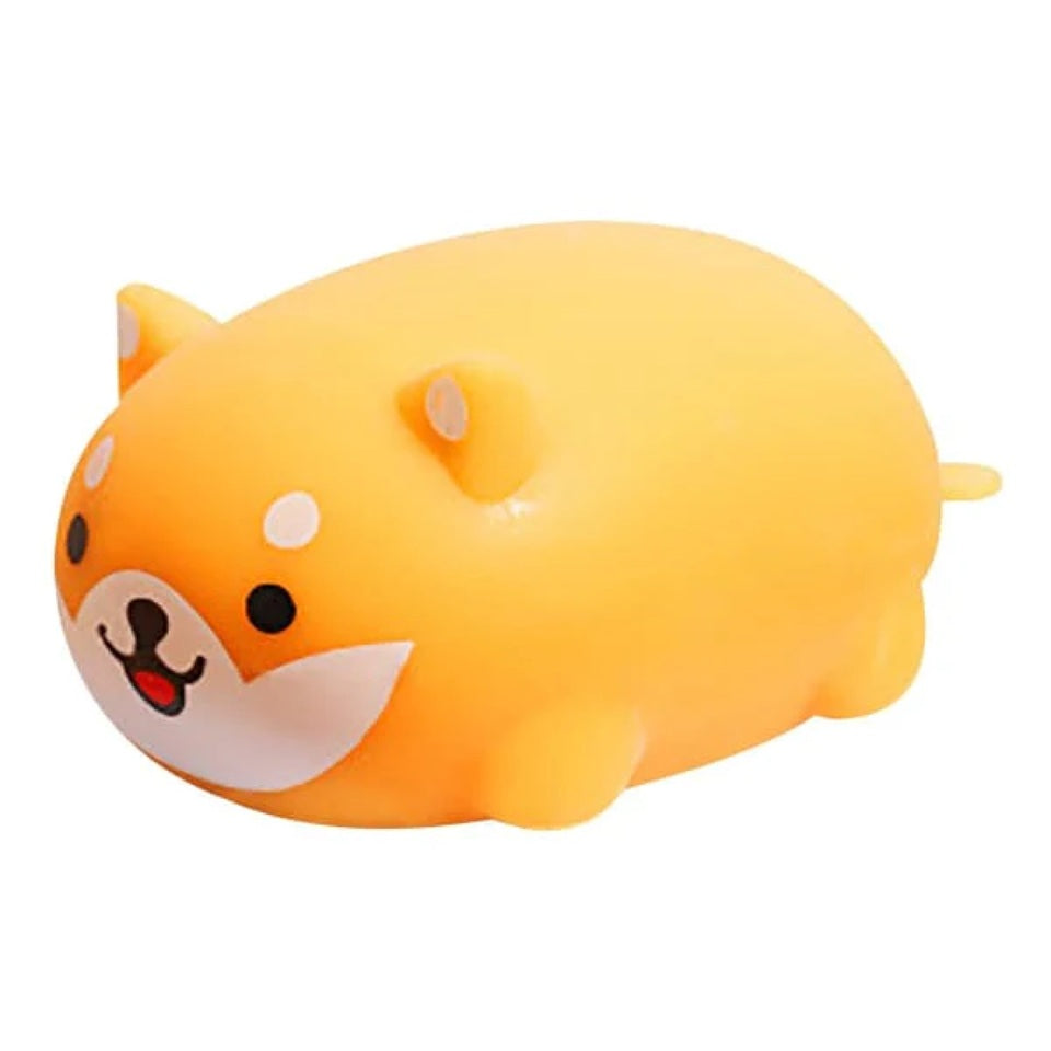 un squishy jaune tout mou en forme de shiba inu rigolo et mignon. Serrez-le pour un effet anti stress immédiat.