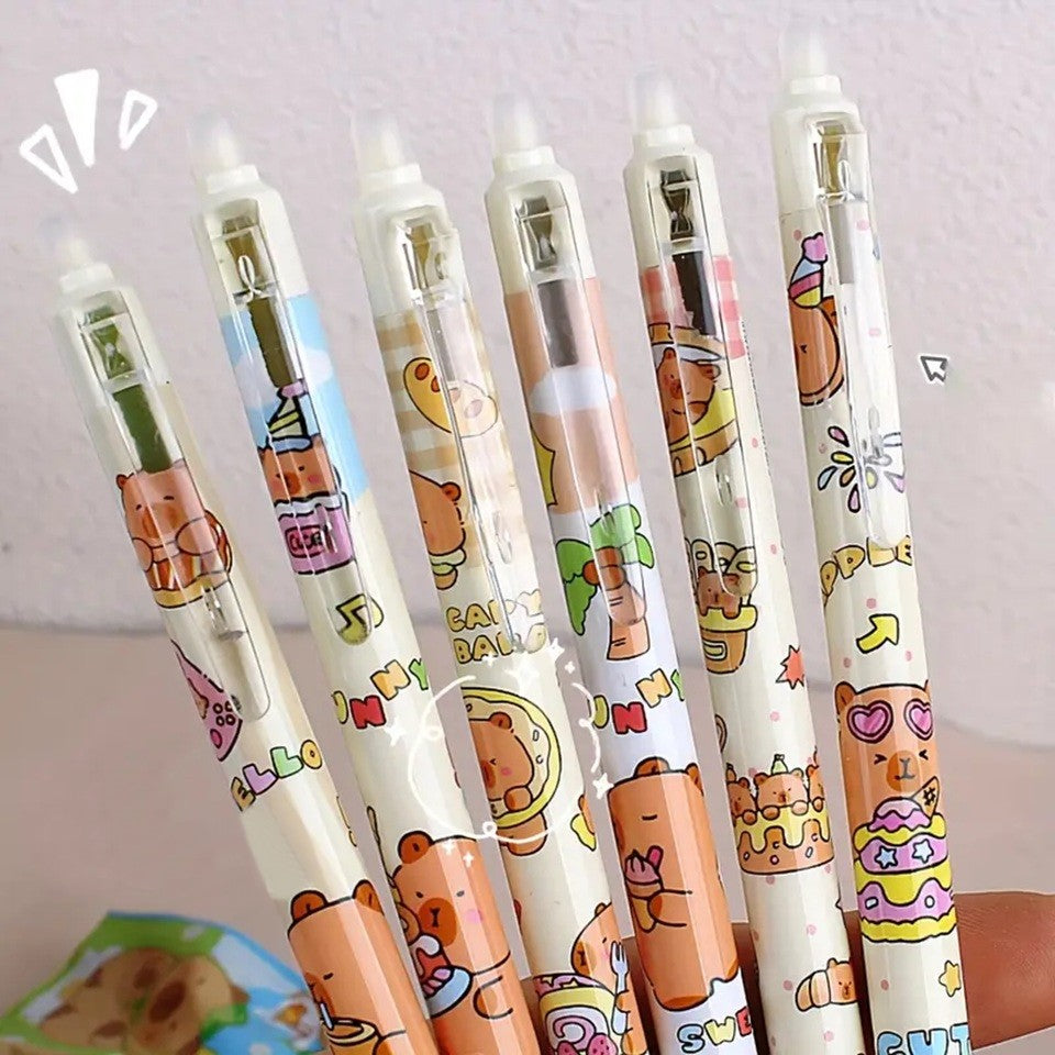 des stylos au design de capybara ultra gourmands qui dégustent des glaces, donuts, gâteaux et autres gourmandises sucrées. Ils sont effaçables !