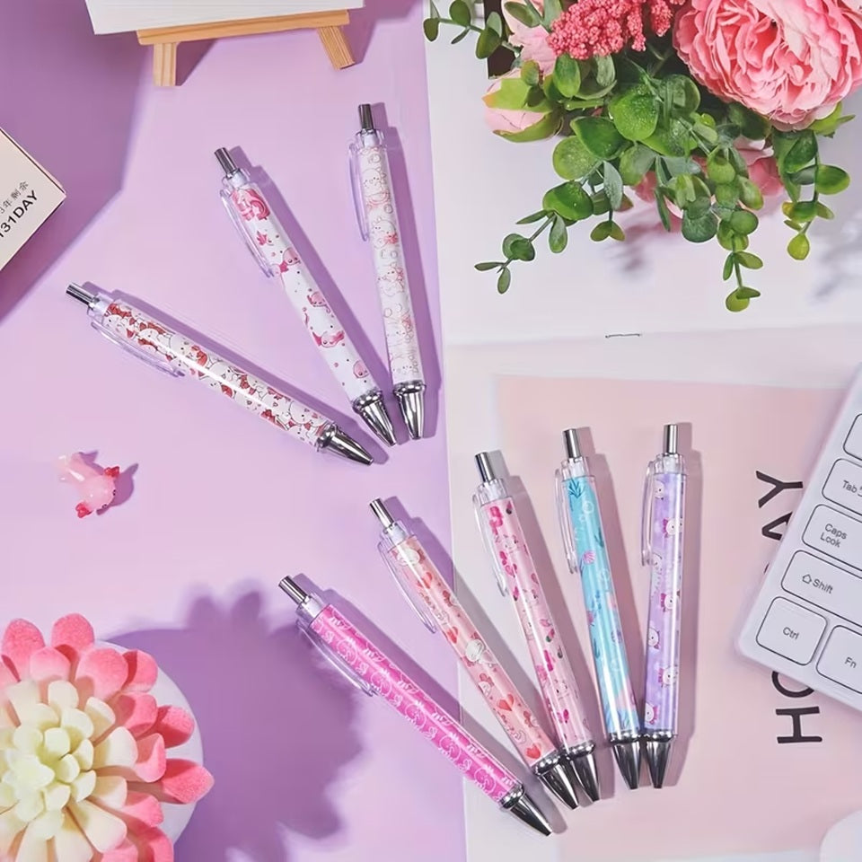 des stylos colorés dans les tons roses mauves blancs illustrés d'axolotl trop mignons !