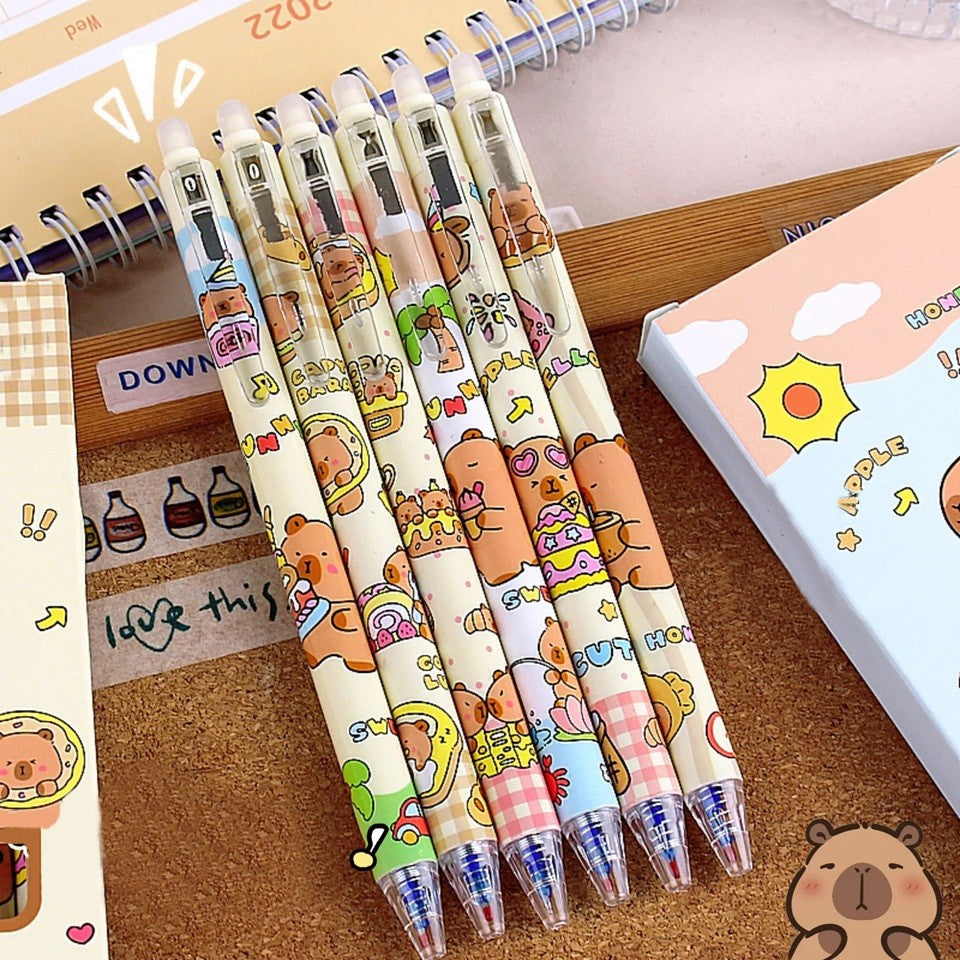 des stylos au design de capybara ultra gourmands qui dégustent des glaces, donuts, gâteaux et autres gourmandises sucrées. Ils sont effaçables !