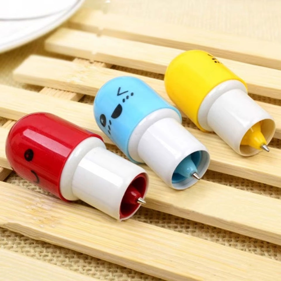 des stylos en forme de gélule colorée avec des expressions kawaii amusantes et fun