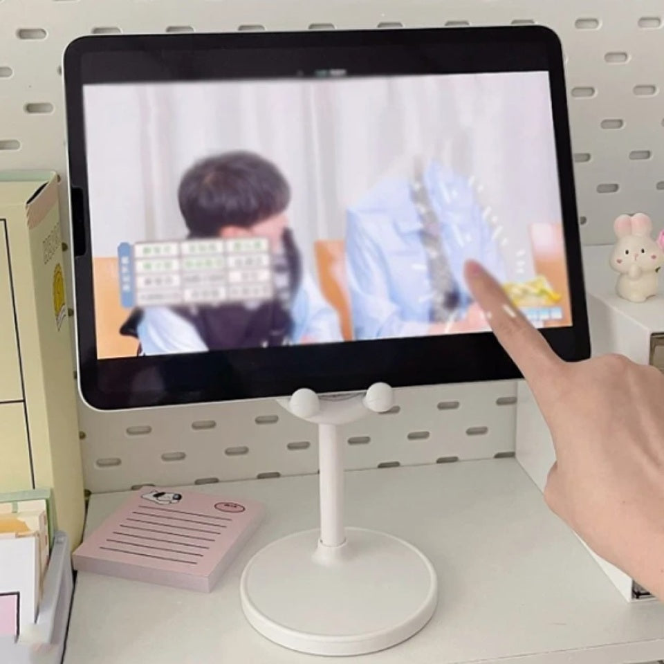 un support pour smartphone et tablette doté d'oreilles de lapin toutes choupi. Il est télescopique et s'adapte à tous les appareils. Idéal également élément de décoration