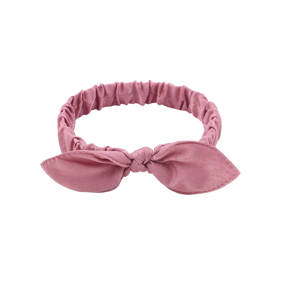 des bandeaux pour cheveux vert, violet ou rose ornés d'un petit noeud tout mignon. Taille élastique.