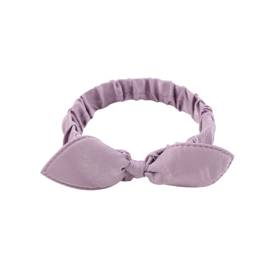 des bandeaux pour cheveux vert, violet ou rose ornés d'un petit noeud tout mignon. Taille élastique.