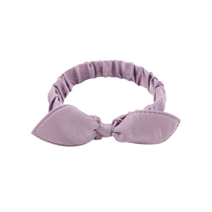 des bandeaux pour cheveux vert, violet ou rose ornés d'un petit noeud tout mignon. Taille élastique.