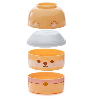 une boite repas bento au motif de shiba inu hyper mignon. Composée de trois compartiments empilables, elle est d'une grande capacité.