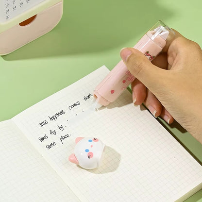 un outil de papeterie qui combine ruban correcteur et colle dans un design en forme de chat ultra mignon.
