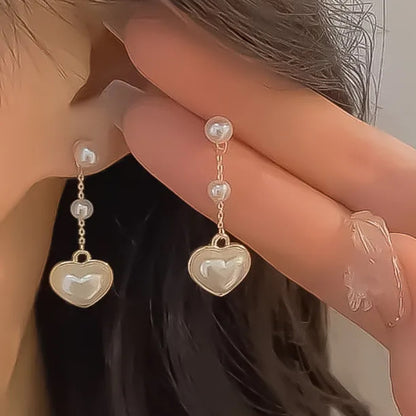 Boucles d'oreilles coeurs perles