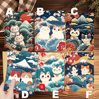 des cartes de voeux toutes mignonnes représentant des chats sur un fond de paysage japonais : vague, mont fuji et fleurs de sakura façon estampe japonaise.