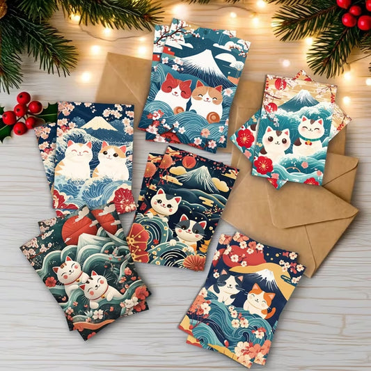 des cartes de voeux toutes mignonnes représentant des chats sur un fond de paysage japonais : vague, mont fuji et fleurs de sakura façon estampe japonaise.