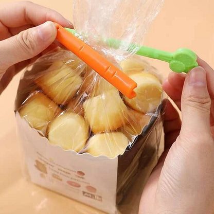lot de 2 pinces en forme de carottes pour refermer hermétiquement tous vos sachets.