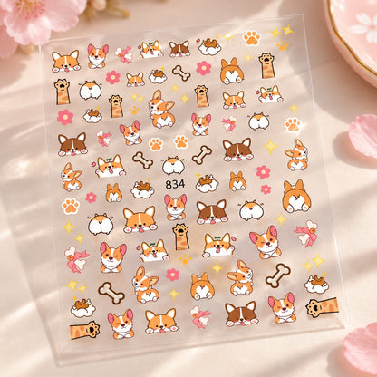 Planche transparente de stickers nail art Corgi kawaii avec petits chiens, pattes, os, fleurs et motifs amusants pour décorer les ongles.