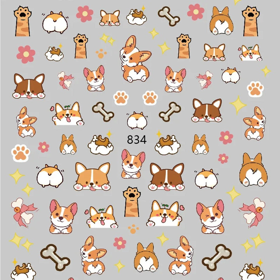 Gros plan des stickers nail art Corgi, petites pattes, os et fesses de chien. Jolie manucure amusante, fun et adorable.