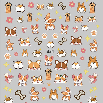 Gros plan des stickers nail art Corgi, petites pattes, os et fesses de chien. Jolie manucure amusante, fun et adorable.
