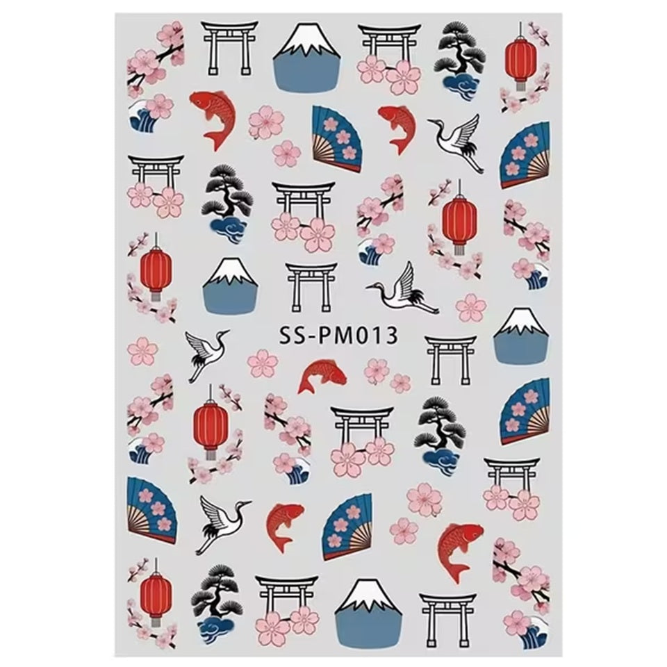 gros plan sur une planche de sticker pour nail art sur le thème du japon : sakura, tori, éventails, carpe koi et mont fuji 