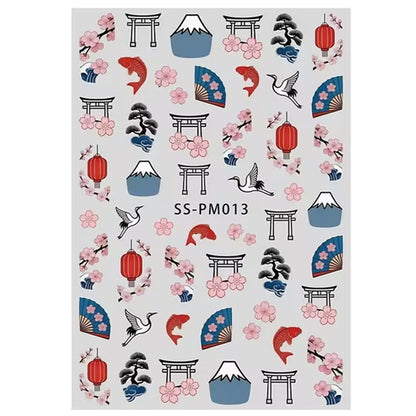 gros plan sur une planche de sticker pour nail art sur le thème du japon : sakura, tori, éventails, carpe koi et mont fuji 