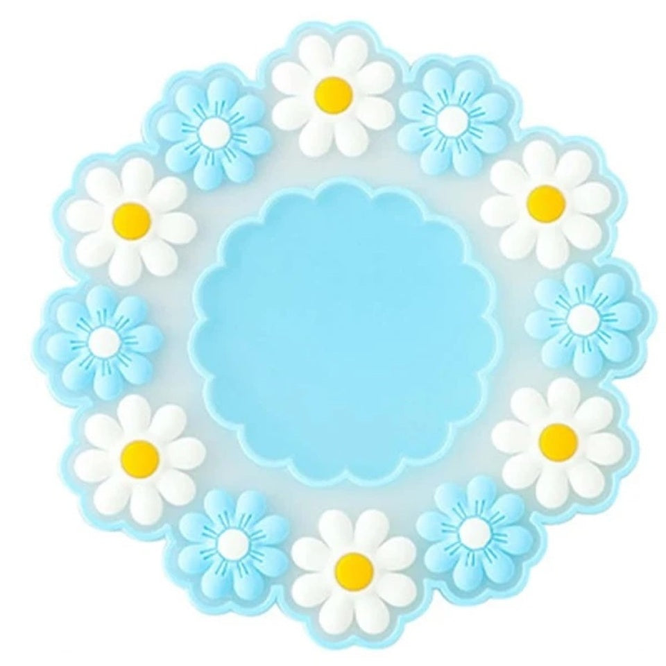 des dessous de verre formés d'une jolie ronde marguerites. En silicone, ils protègent toutes vos surfaces. Ils ajoutent une touche florale et décorative à votre table.