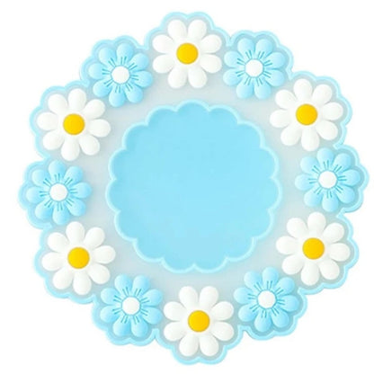 des dessous de verre formés d'une jolie ronde marguerites. En silicone, ils protègent toutes vos surfaces. Ils ajoutent une touche florale et décorative à votre table.