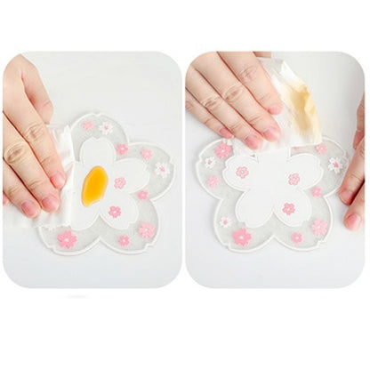 un dessous de verre en forme de fleur de sakura blanche pailleté. Joli élément de décoration