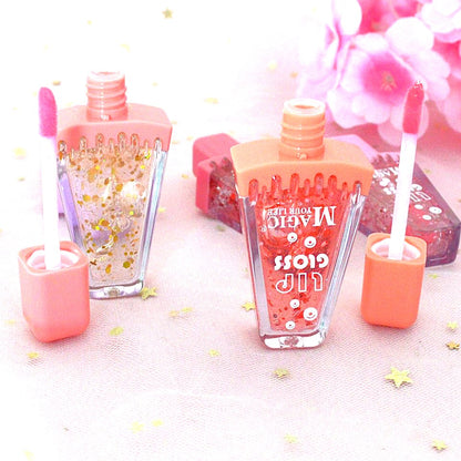 des gloss parfumé en forme de part de pastèque hyper mignon ! A l'intérieur du gloss, il y a des paillettes pour un effet encore plus brillant !