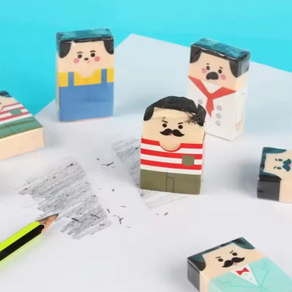 Des gommes de forme rectangulaire représentant des monsieur moustachus aux cheveux noirs. Au fur et à mesure des utilisations, le monsieur devient chauve ! Ludique, amusante à utiliser !