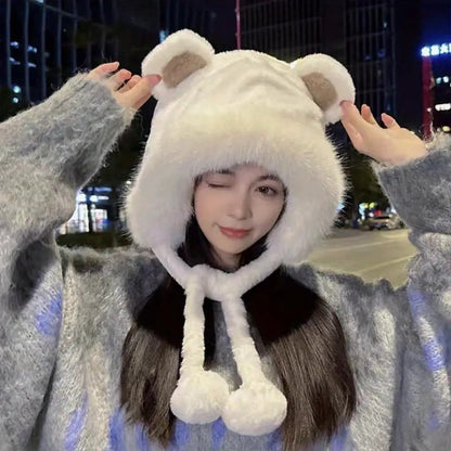 un bonnet tout fluffy et super doux doté d'oreilles d'ourson trop choupi et deux pompons