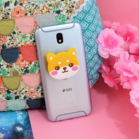 un support pour smartphone à coller sur la coque pour un maintien renforcé.