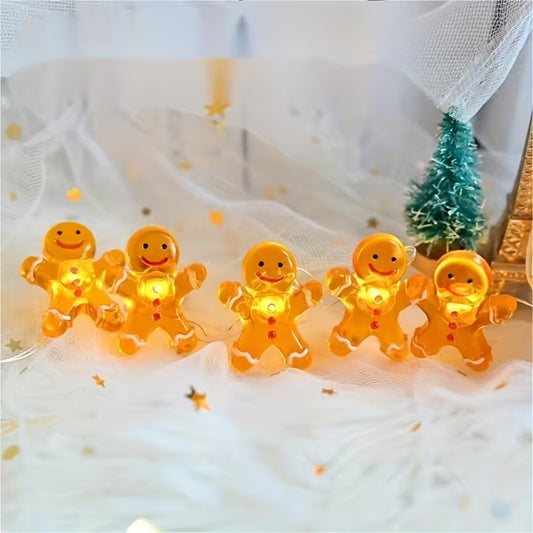 une adorable guirlande LED en forme de bonhomme en pain d'épice. Hyper mignonne, elle fonctionne à piles et sa douce lumière chaude crée une ambiance cocooning et magique. Idéale pour décorer une table de Noël ou une chambre.
