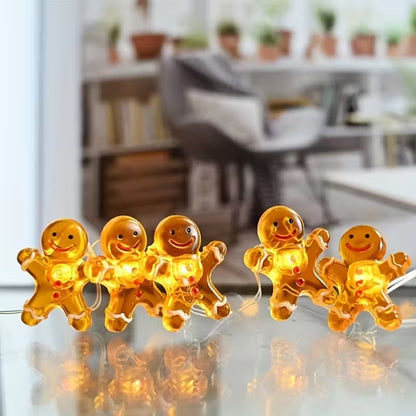 une adorable guirlande LED en forme de bonhomme en pain d'épice. Hyper mignonne, elle fonctionne à piles et sa douce lumière chaude crée une ambiance cocooning et magique. Idéale pour décorer une table de Noël ou une chambre.