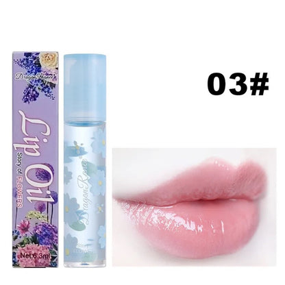 des huiles pour les lèvres aux doux doux parfums de fleurs. Les tubes sont colorés et en verre avec un design de fleurs.