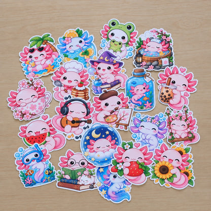 Lot de stickers kawaii axolotl roses et colorés, aux motifs variés : fraise, fleurs, bubble tea, magie et animaux mignons. Stickers décoratifs découpés avec contour blanc, parfaits pour personnaliser carnets, agendas et journaux.