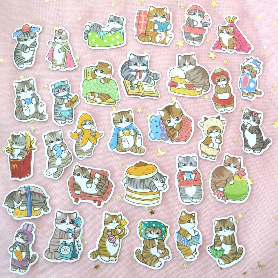un lot de stickers de chats tigrés dans des poses et scènes cocasses et trop mignonnes.