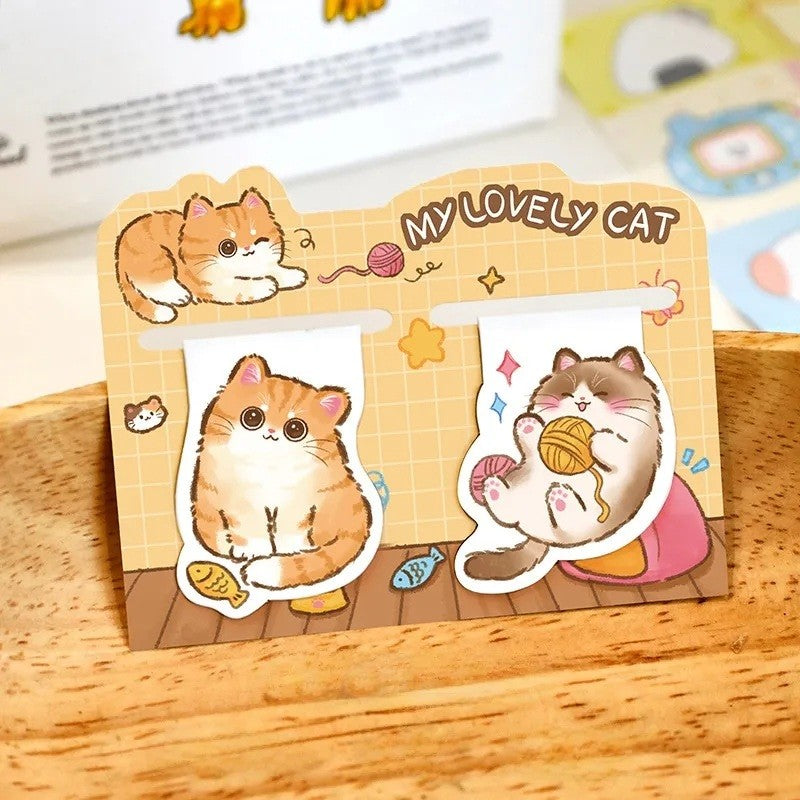 Un lot de 2 marque-pages aimantés en forme de chat roux et marron. Ils sont trop mignons avec leurs expressions adorables.