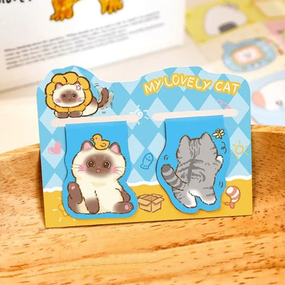 Un lot de 2 marque-pages aimantés en forme de chat gris et blanc. Ils sont trop mignons avec leurs expressions adorables.
