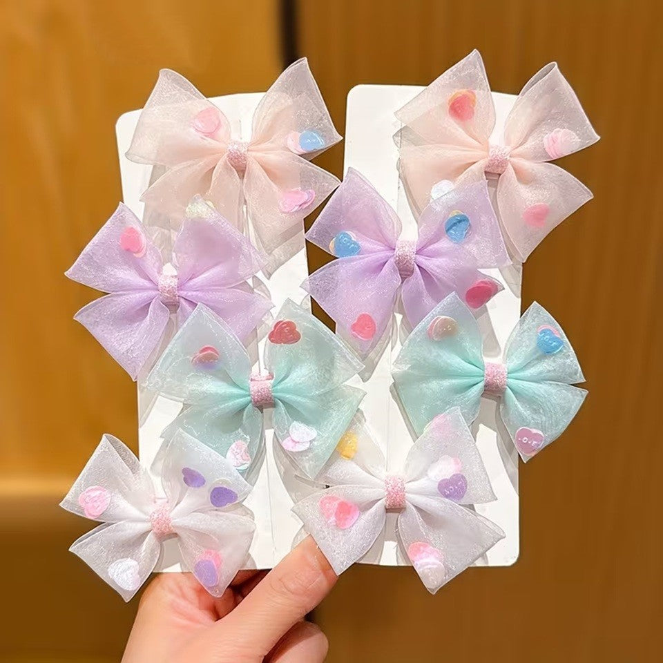 des barrettes à cheveux en organza coloré et transparent. A l'intérieur, il y a des petits coeurs colorés. Look romantique, mignon, girly !