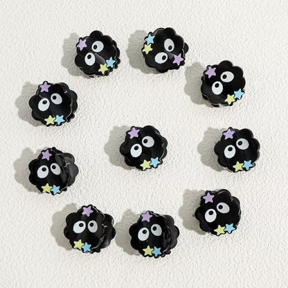 un lot  de 2 pinces à cheveux en forme de noiraudes avec leurs petites étoiles colorées.