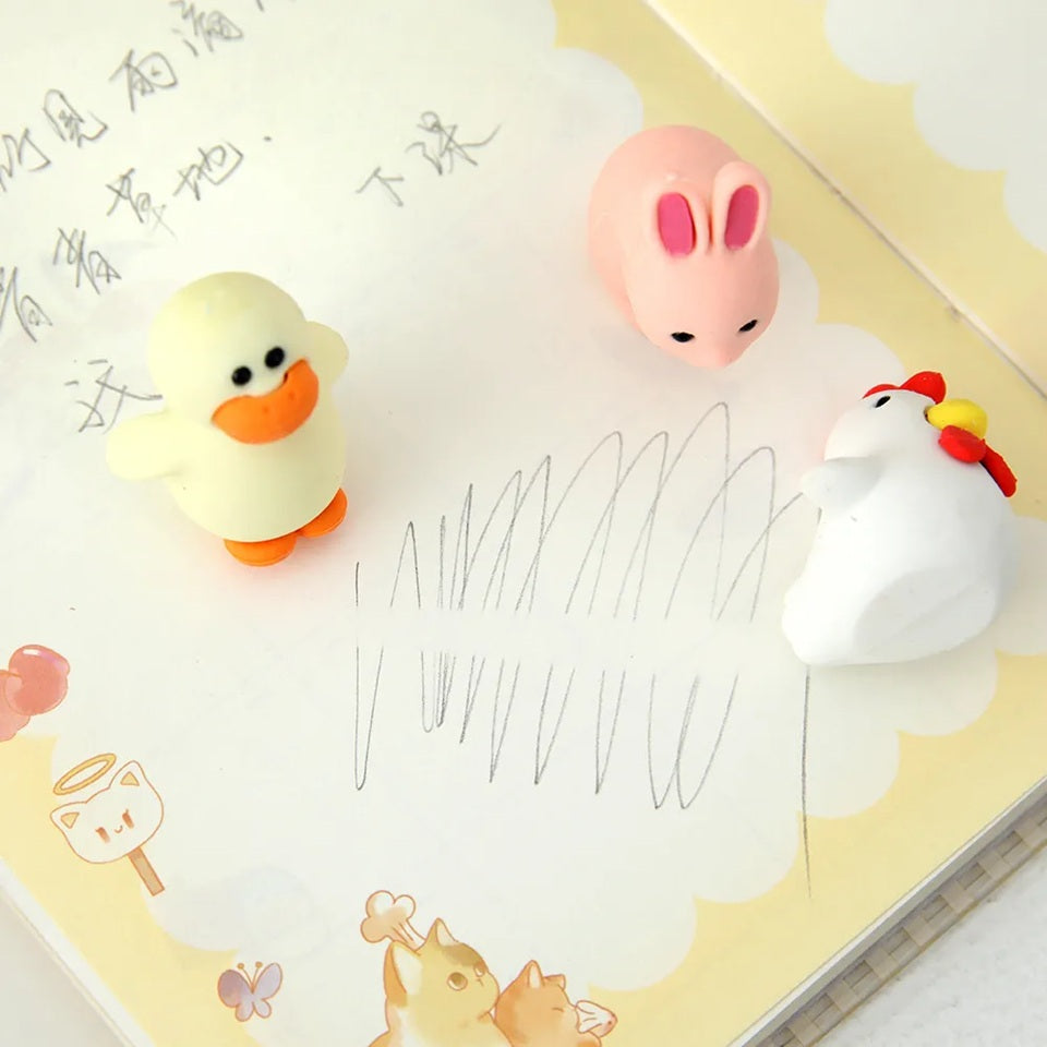 un lot de 4 gommes animaux de la ferme : poule, poussin et oeuds, lapin et canard. Formes originales et adorables